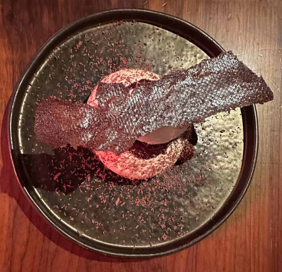 Image of cherry dessert served at Fallow, the sustainable restaurant in London's West End. The dish features locally sourced ingredients and showcases the restaurant's commitment to eco-friendly dining