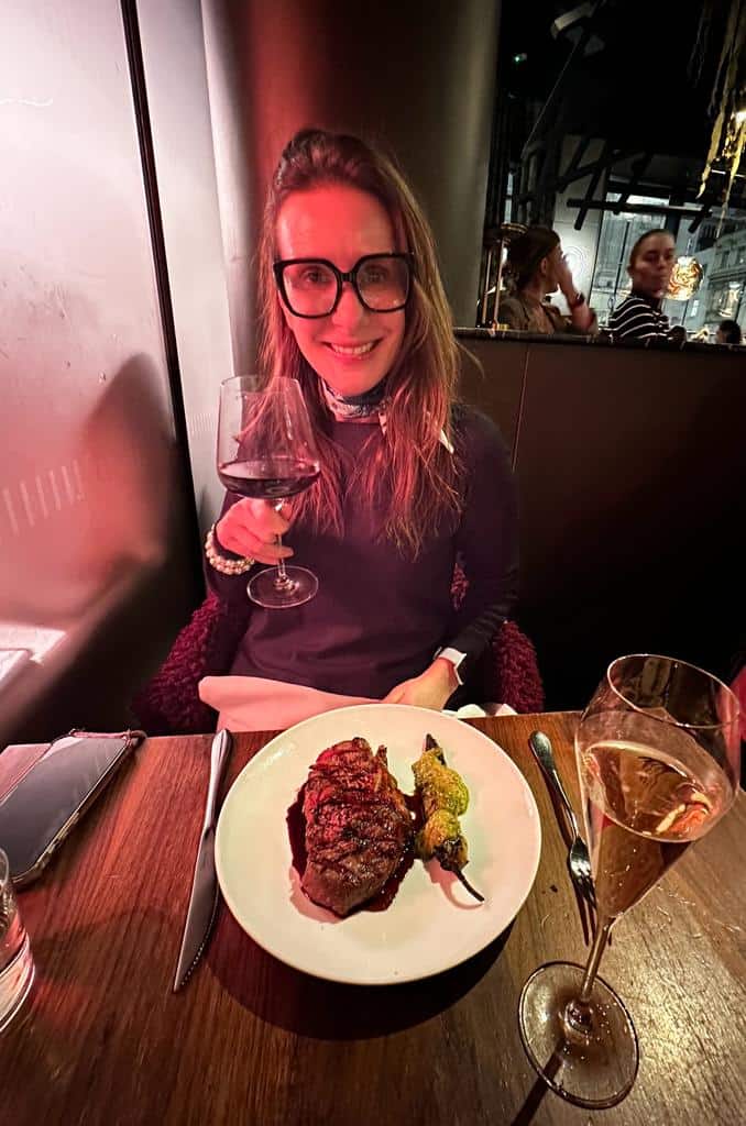 Image of Rebecca Williams and the steak served at Fallow, the sustainable restaurant in London's West End. The dish features locally sourced ingredients and showcases the restaurant's commitment to eco-friendly dining