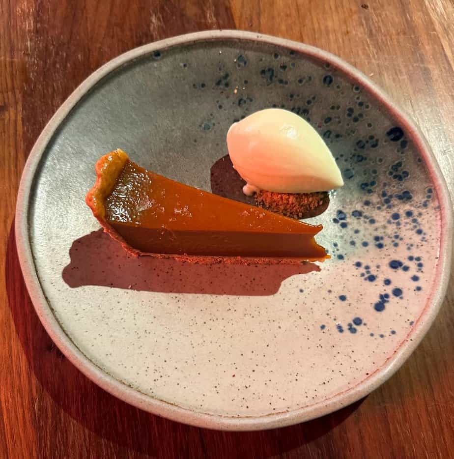 Image of the Chelsea Tart served at Fallow, the sustainable restaurant in London's West End. The dish features locally sourced ingredients and showcases the restaurant's commitment to eco-friendly dining